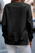 Black sweatshirt with snap buttons and side slits