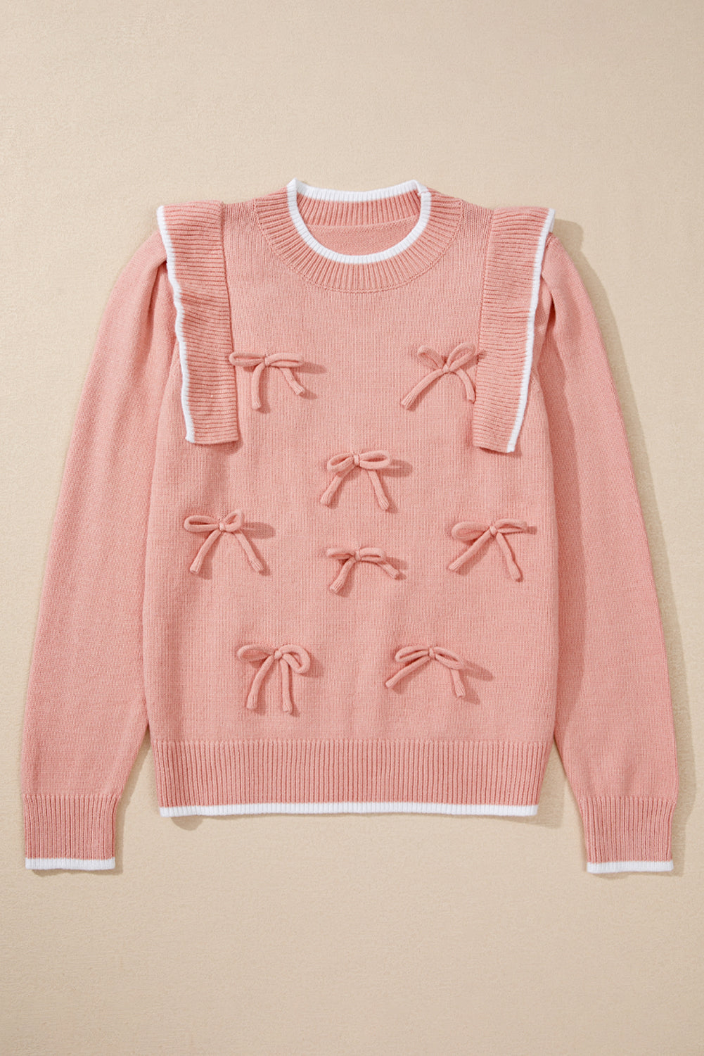 Pull à manches longues et bordure côtelée avec nœud papillon et volants rose clair