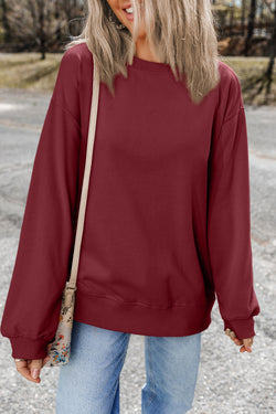 Solid burgundy sweatshirt with dropped shoulders and round neck