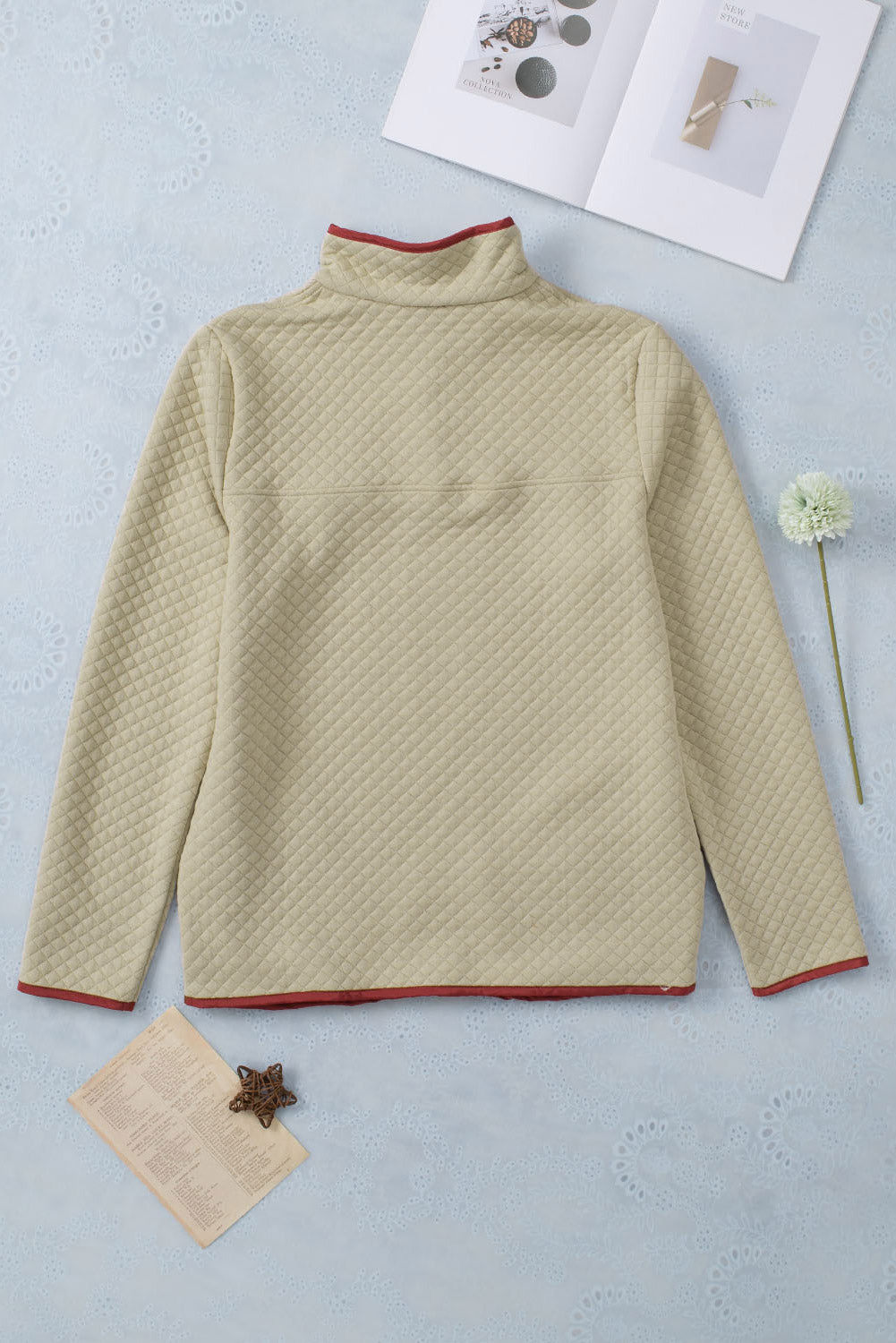 Beige geometric sweatshirt with snap buttons and contrast binding