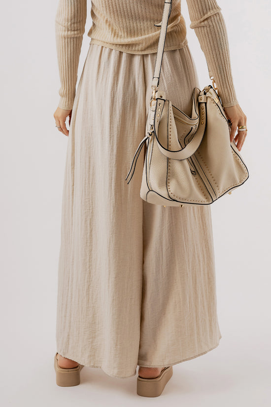 Large pleated leg relaxed pants with beige tightening cord