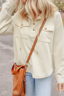 Apricot textured hoodie with button-down neckline and side pockets