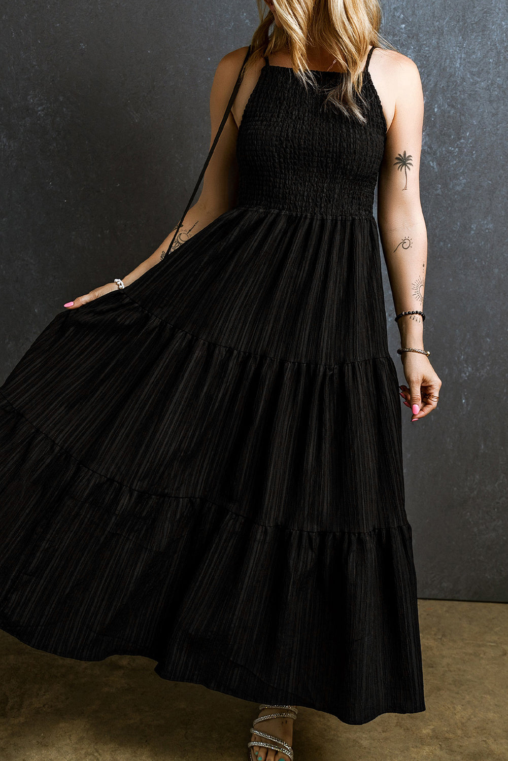 Black long dress with ruffles and spaghetti straps, smocked and pleated