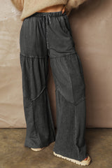 Pantalon large noir délavé à empiècements et coutures apparentes