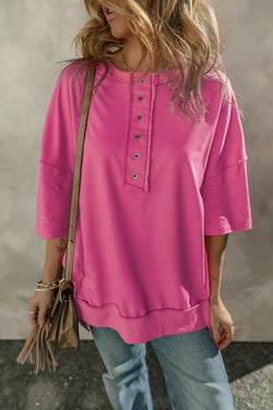 High tunic with wide sleeves and buttoned collar with apparent red pink seams