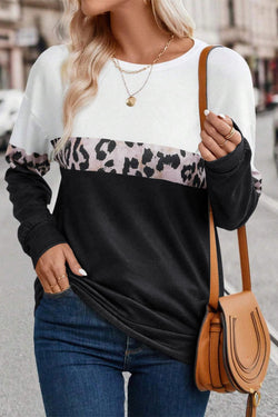 Black leopard top with long sleeves and a color block crew neck