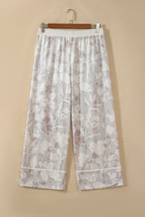 Pantalon ample gris grande taille à imprimé camouflage floral et finitions contrastées