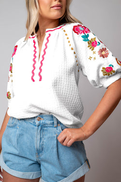 White textured blouse with puffy sleeves and Ricrac floral embroidery