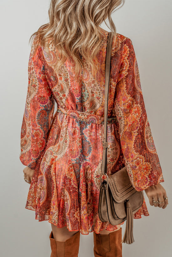 Orange bohemian paisley print mini dress with long sleeves and pleated belt