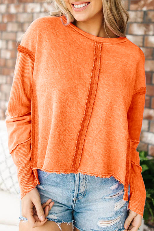 Orange exponiertes hochniedriges, rohes Kanten -Sweatshirt