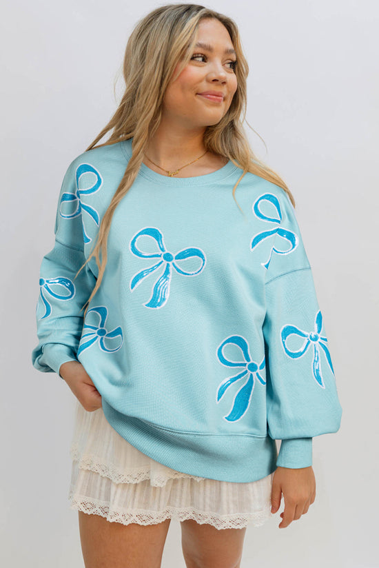 Over-dimensional sequined sweatshirt and butterfly knot with drooping shoulder