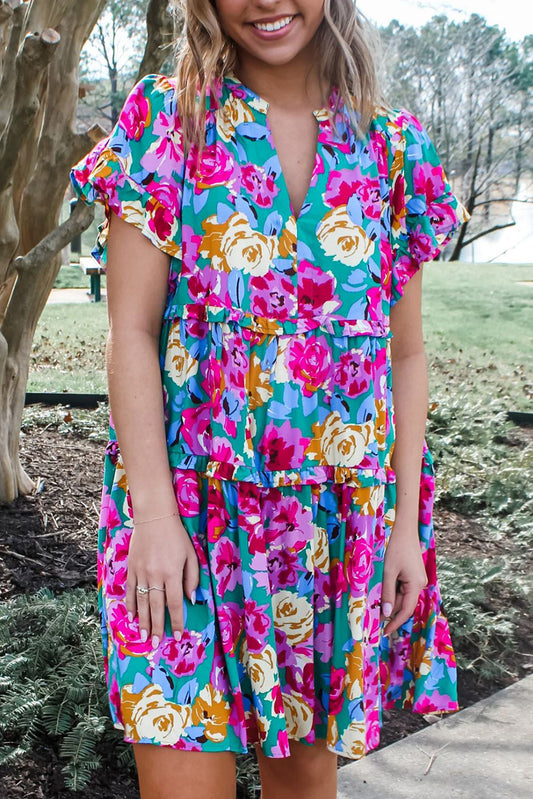 Short dress with ruffles and pink green floral print