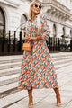 High waisted dress with long sleeves and multi-colored abstract geometric print