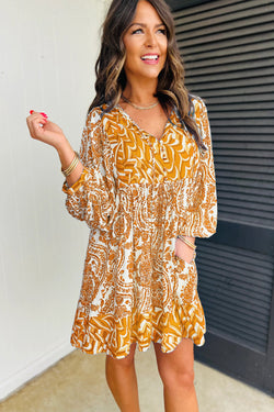 Orange bohemian print flared mini dress with puff sleeves and knotted V-neck