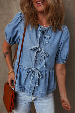 Twilight blue denim shirt tied on the front with bubble and basque sleeves