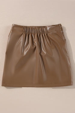 Mini-skirt in imitation leather at the bow tie