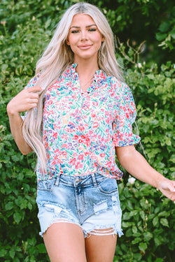 Pink blouse with floral print and buttoned, split collar, puffy sleeves