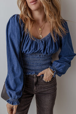 Smocked dark blue jeans blouse with ruffles and puffy sleeves in V -neck