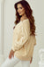 Beige sweatshirt with buttoned sleeves and dropped shoulders