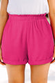 Large pink textured shorts with rolled edges and ruffles, elastic waist