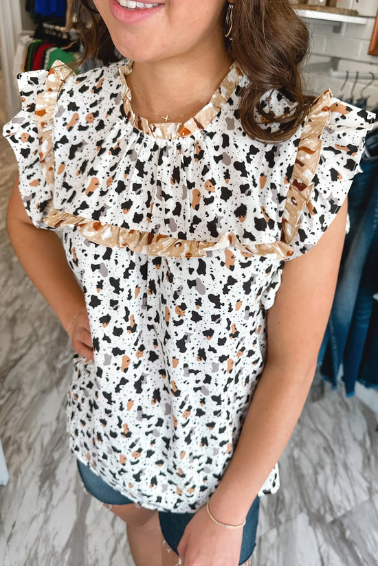 White polka dot blouse and ruffle leopard print