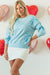 Over-dimensional sequined sweatshirt and butterfly knot with drooping shoulder