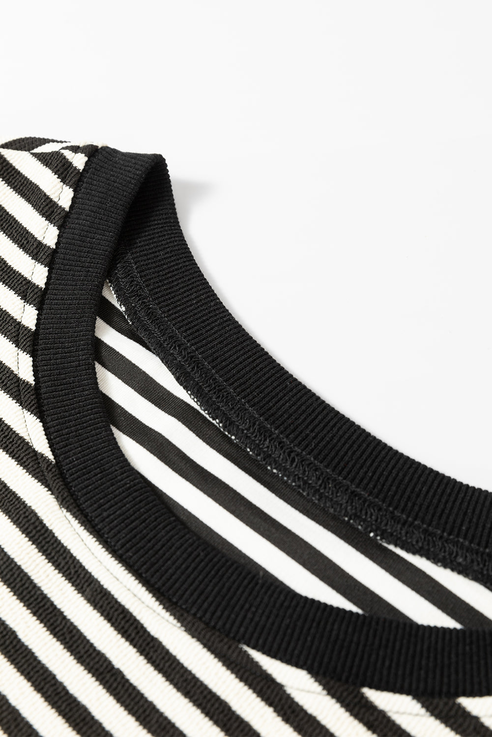 Long sleeve top and drooping shoulders with black stripes