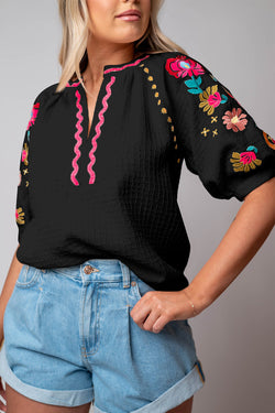 Black textured blouse with puffy sleeves and Ricrac floral embroidery