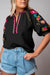 Black textured blouse with puffy sleeves and Ricrac floral embroidery