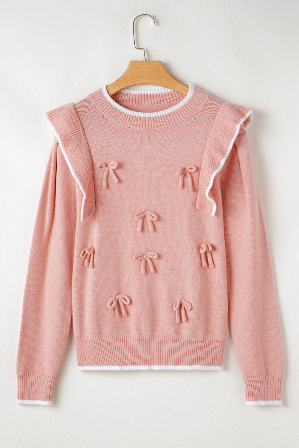 Pull à manches longues et bordure côtelée avec nœud papillon et volants rose clair