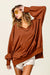 Oversized chestnut V-neck hoodie with kangaroo pocket