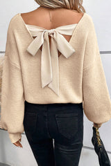 Pull abricot à manches lanternes, col en V, nœud au dos