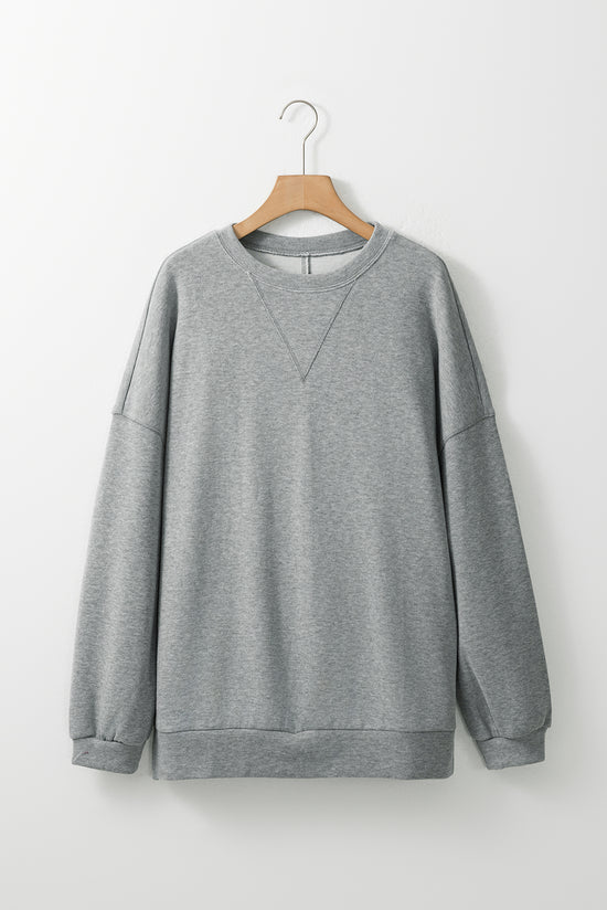 Middle-to-sloping gray oversized gray sweatshirt and side slit