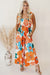 Long orange floral dress with straps tied at the smocked bust