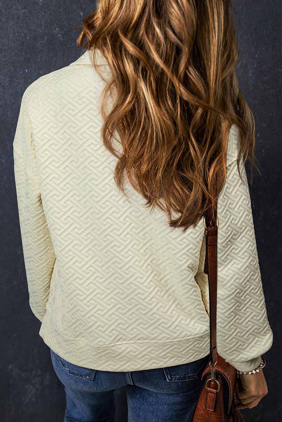 Beige textured half zip collar sweatshirt in solid color