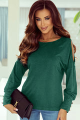 Haut asymétrique vert boutonné à manches longues et découpes