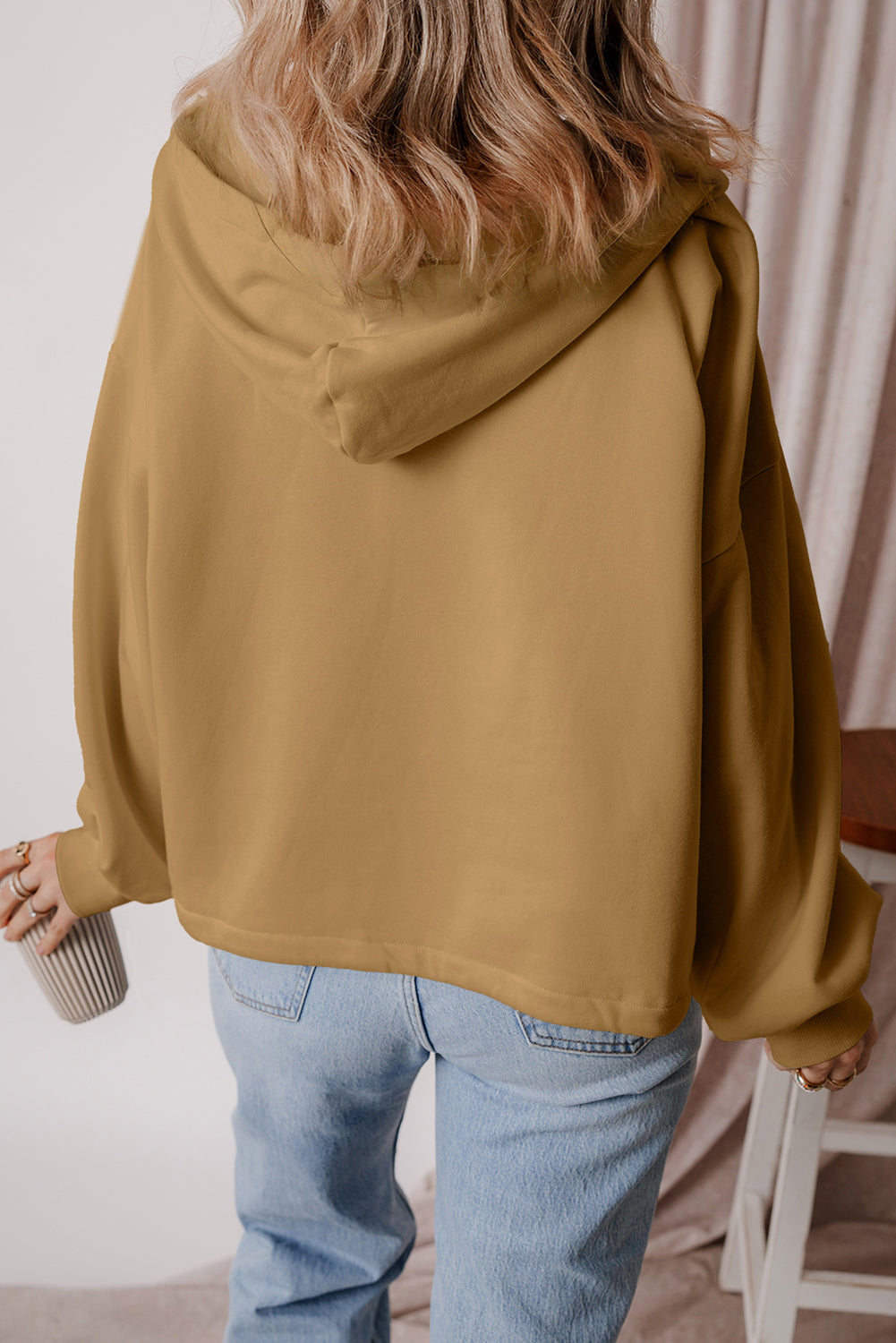 Brown loose hoodie with kangaroo pockets and half-zip lined with fleece