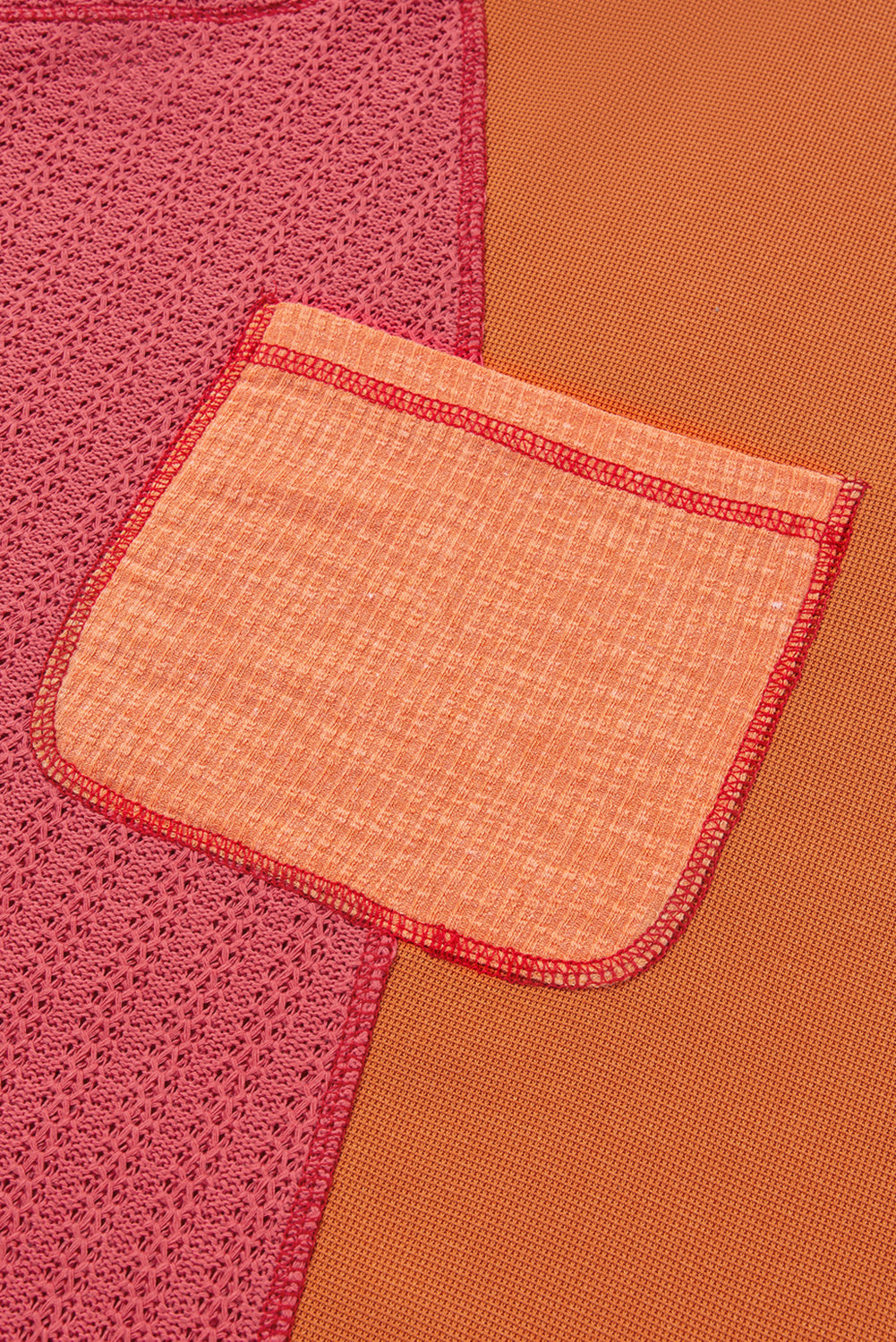 Haut orange en tricot texturé avec bloc de couleurs et poche poitrine en patchwork de grande taille