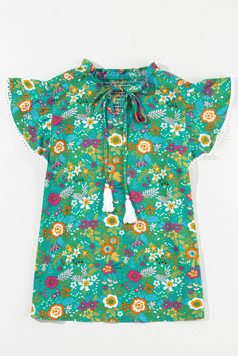 Blouse florale tropicale à manches flottantes et bordure en dentelle verte