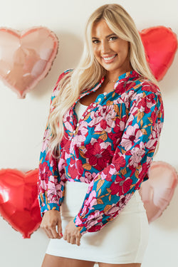 Red blouse with balloon sleeves and floral print, half-boutons