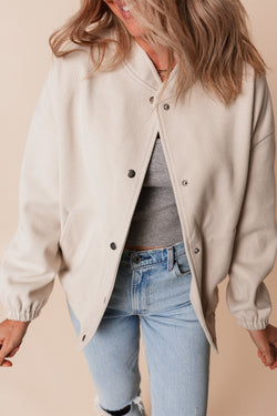 Beige bomber jacket with pockets and baseball collar