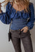 Smocked dark blue jeans blouse with ruffles and puffy sleeves in V -neck