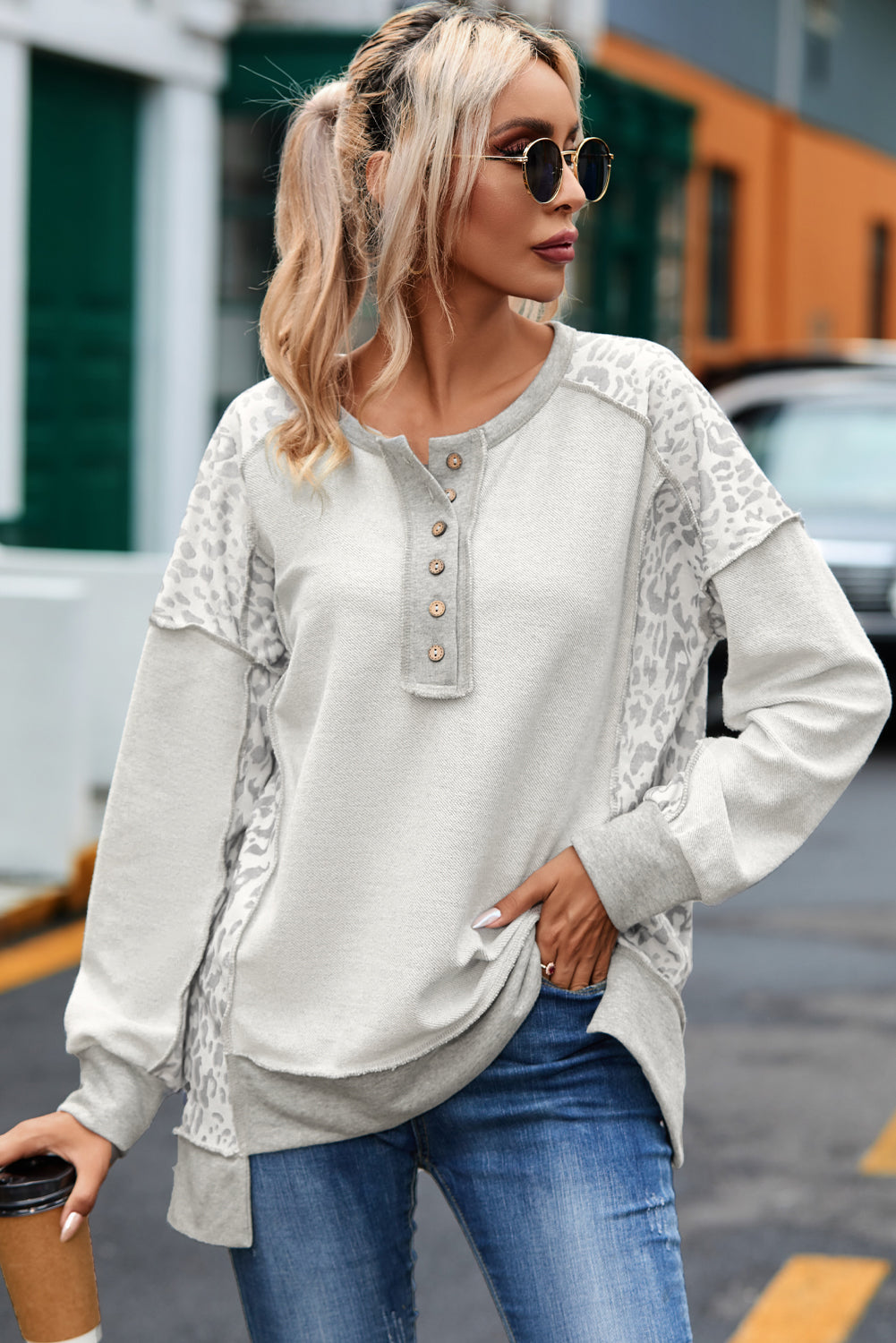 Gray Sweatshirt with buttoned collar and exposed seams in leopard patchwork