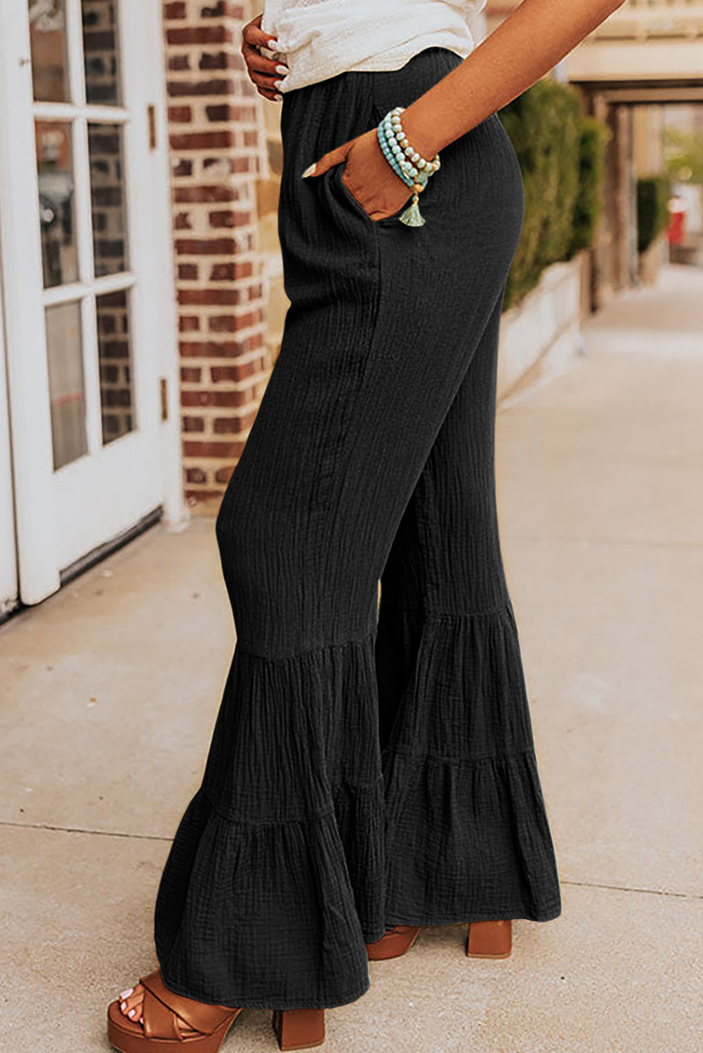 Black textured high waisted ruffle bell bottom pants