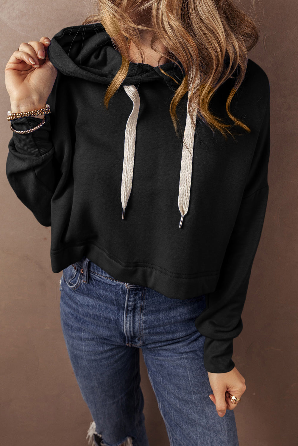 Short black hooded plain with drooping shoulders *