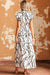 Long white dress with ruffles and V -collar with an abstract vein print