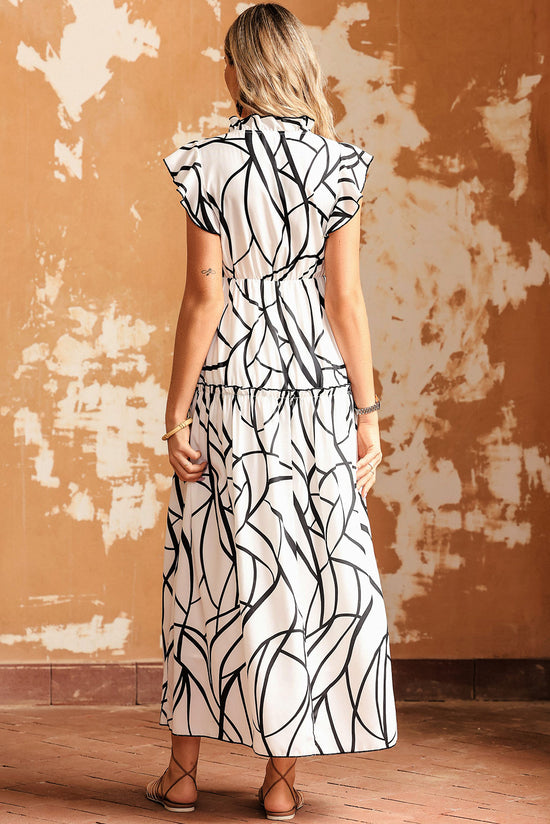 Long white dress with ruffles and V -collar with an abstract vein print