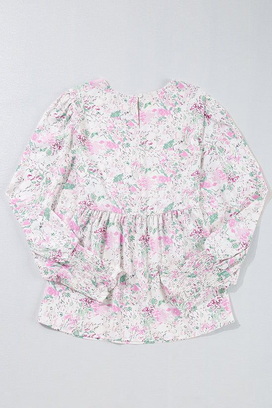 Babydoll pink blouse with floral print and frozen balloon sleeves with lock hole on the back