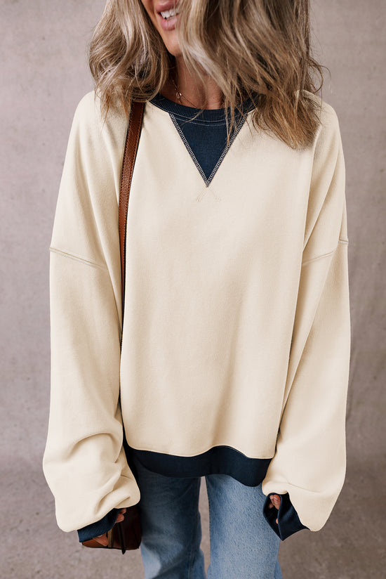 White oversized sweatshirt with dropped shoulders and color block patch