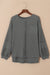 Grey waffle knit top with bubble sleeves and patchwork with exposed seams